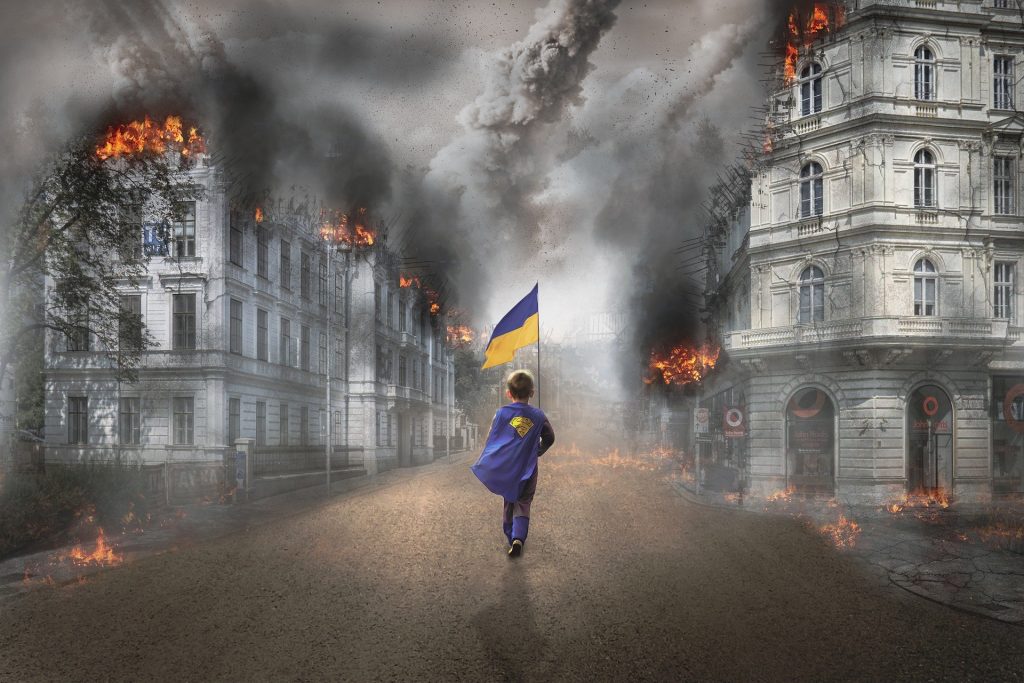 ukraina gutt med flagg i krigsruiner