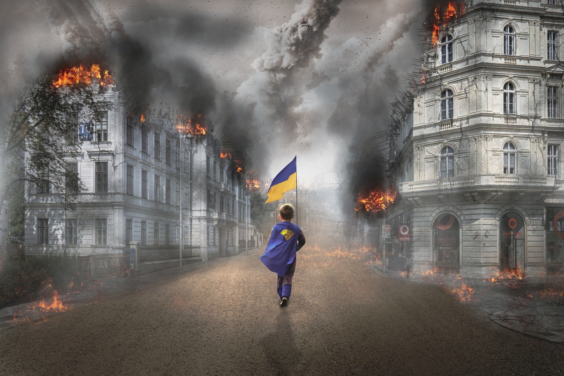 ukraina gutt med flagg i krigsruiner